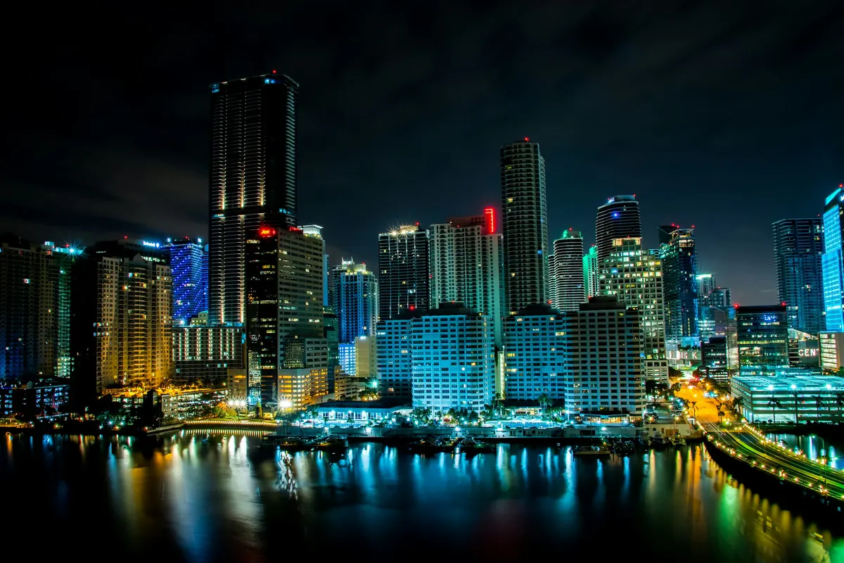 The Miami skyline reflected in the bay at night